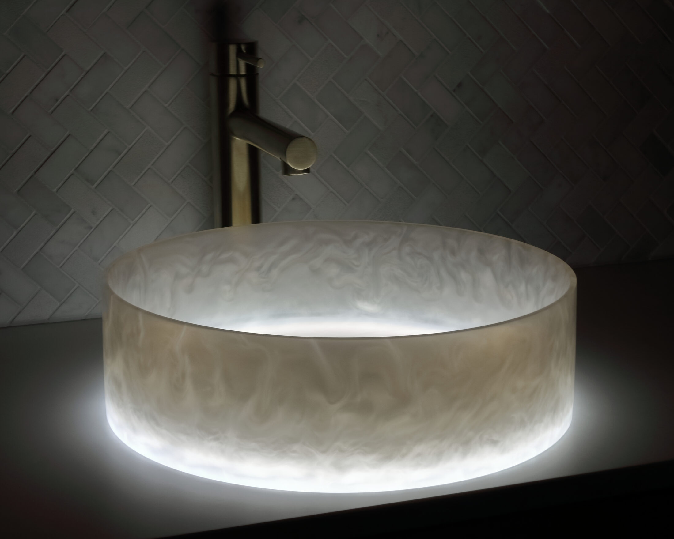 The Basin Lab's dove grey coloured resin basin from their akoya series illuminated by their lightbox